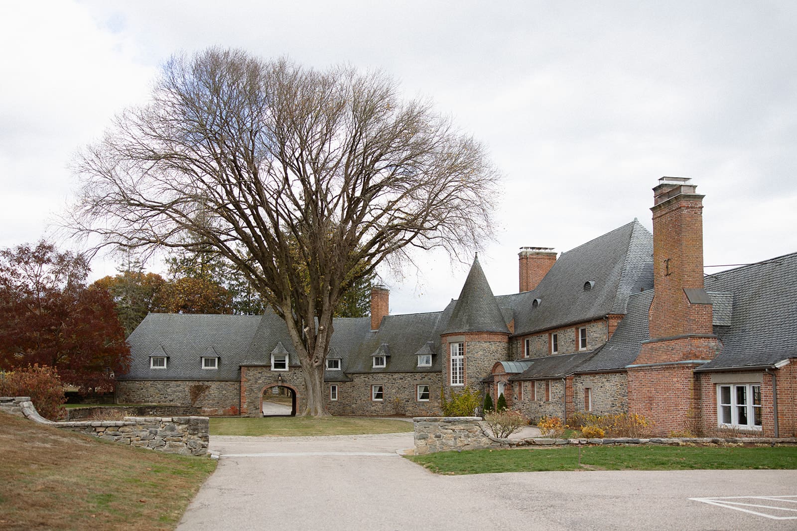 Historic stone manor and grounds at Shepherd’s Run, a vineyard estate wedding venue in Rhode Island.