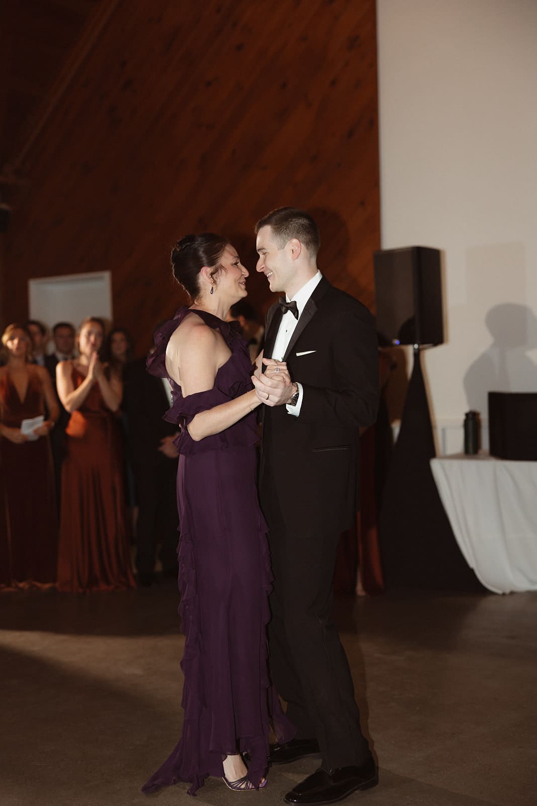 Groom dancing with his mother during heartfelt reception moment at a classic Rhode Island wedding venue.