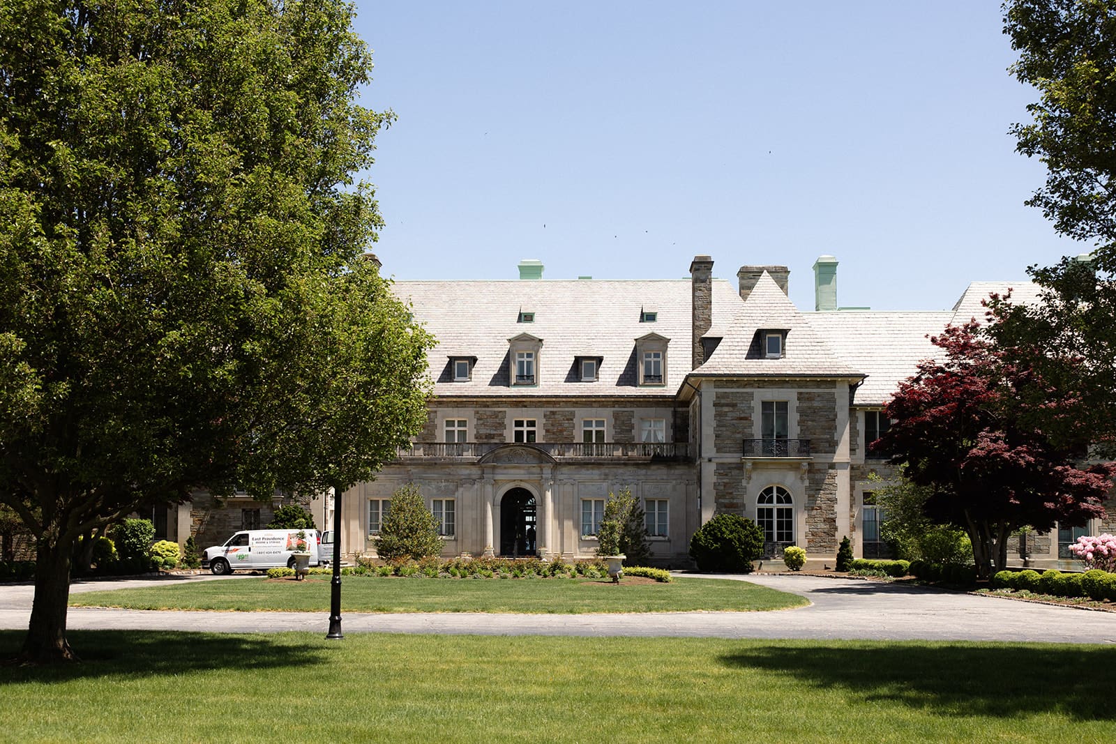 A view of the estate from across the lawn, showing the full scale and architecture of the venue.
